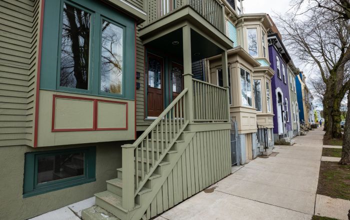 Halifax housing market_colourful front doors lining sidewalk