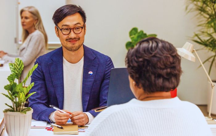 REMAX real estate agent with client