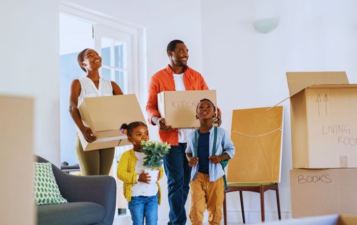 Family moving in and talking about How Much to Budget for Moving Costs