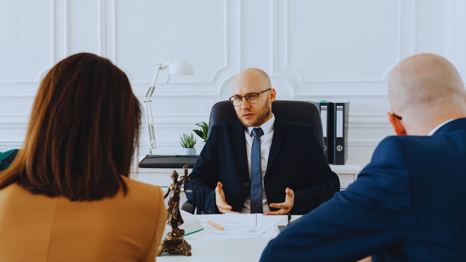Couple meeting with a mortgage advisor to discuss home financing options and pre-approval for buying a house in Canada