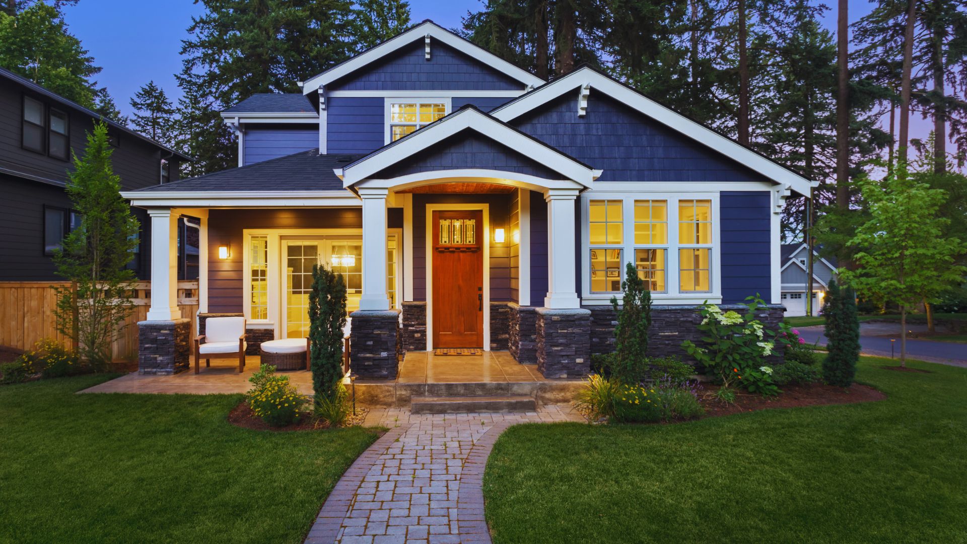 Wooden house-shaped cutout labelled “Property Tax” beside a calculator, representing homeownership costs